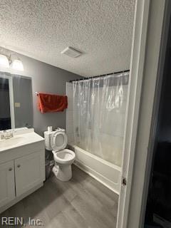3536 Dublin Ct, Virginia Beach, VA 23453 - bathroom featuring toilet, vanity, wood finished floors, a textured ceiling, and shower / bath combination with curtain