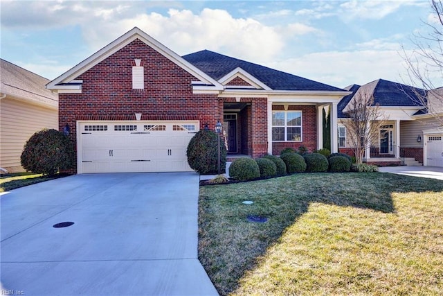 view of front facade with a front yard, brick siding, driveway, and an attached garage