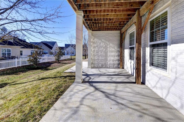 view of patio / terrace with a residential view and fence