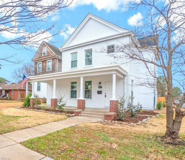 view of front of home featuring a porch and a front yard