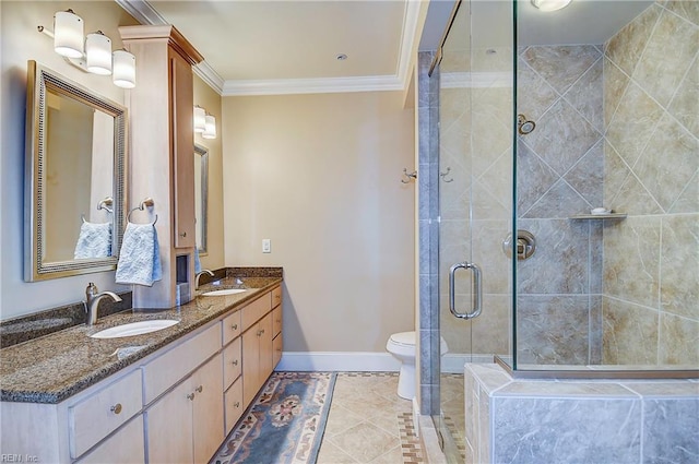 full bathroom featuring a sink, baseboards, double vanity, a stall shower, and crown molding