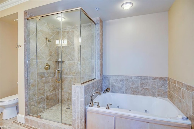 full bathroom with a jetted tub, a shower stall, toilet, and tile patterned floors