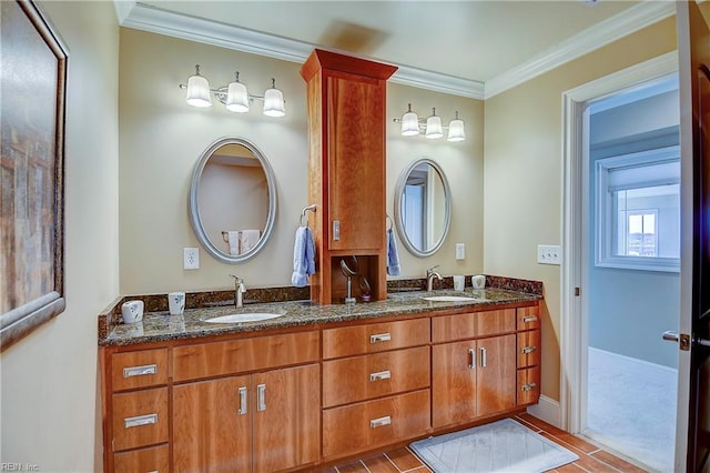 full bathroom with ornamental molding, a sink, baseboards, and double vanity