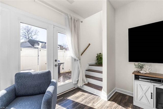 interior space featuring stairs, baseboards, dark wood finished floors, and french doors