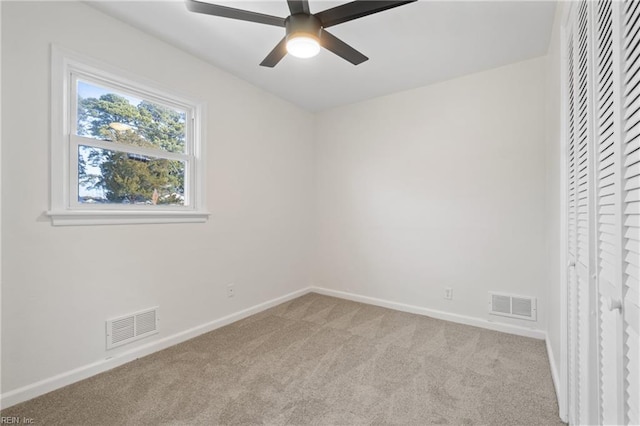 unfurnished bedroom with baseboards, visible vents, and carpet flooring