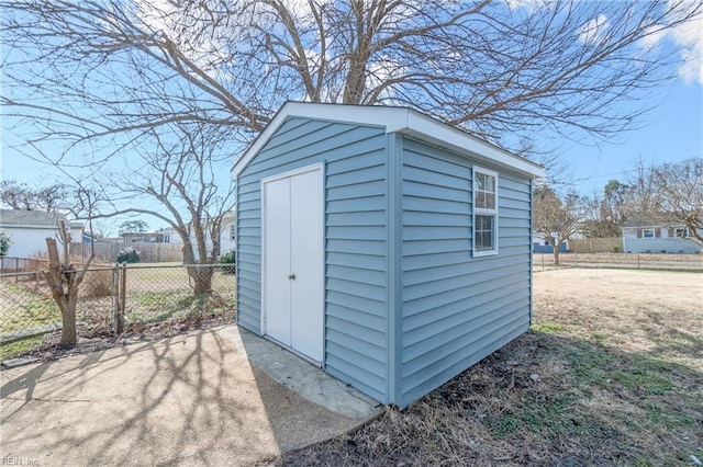 view of shed with fence