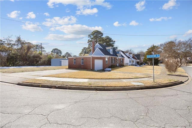 view of front facade featuring concrete driveway and an attached garage