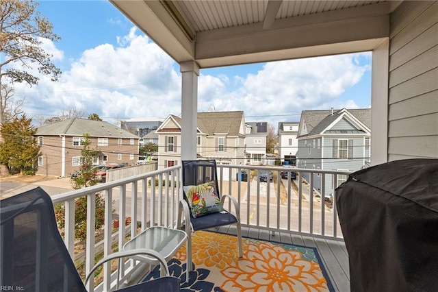 balcony with a grill and a residential view