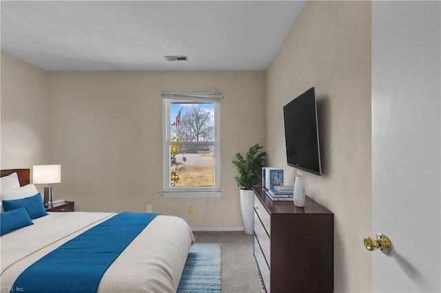 bedroom with light carpet, baseboards, and visible vents