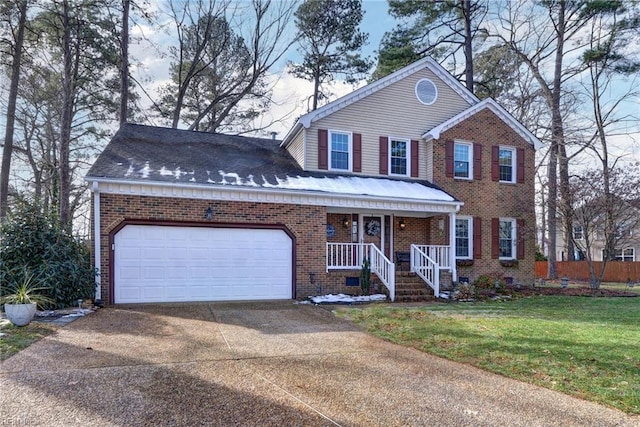 view of front of house featuring driveway, an attached garage, covered porch, a front yard, and brick siding