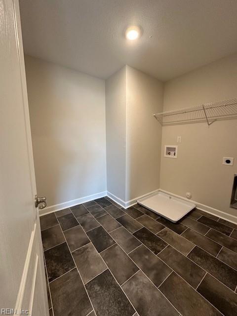 laundry area featuring washer hookup, laundry area, hookup for an electric dryer, and baseboards