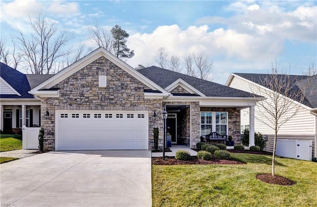 view of front facade with a garage, driveway, a front lawn, and roof with shingles