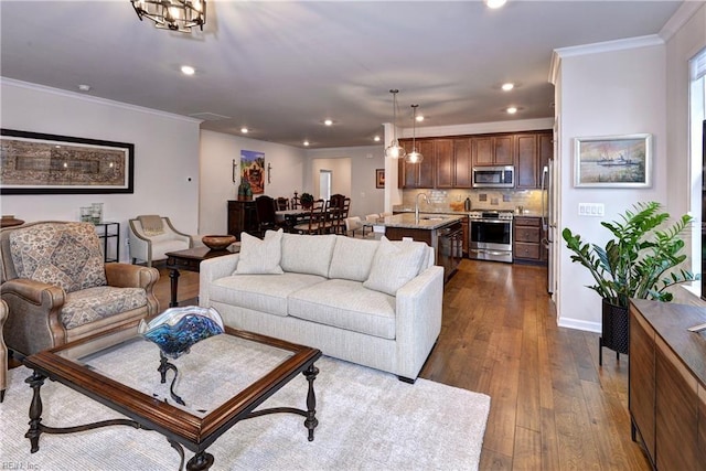 living room with ornamental molding, recessed lighting, baseboards, and dark wood-style floors