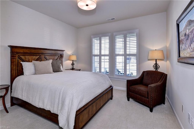 bedroom with light carpet, visible vents, and baseboards