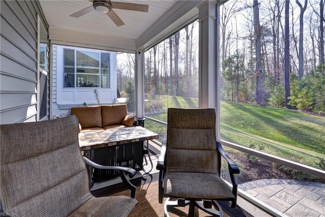 sunroom / solarium with ceiling fan