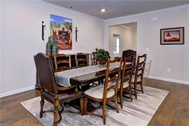 dining space featuring crown molding, wood-type flooring, visible vents, and baseboards