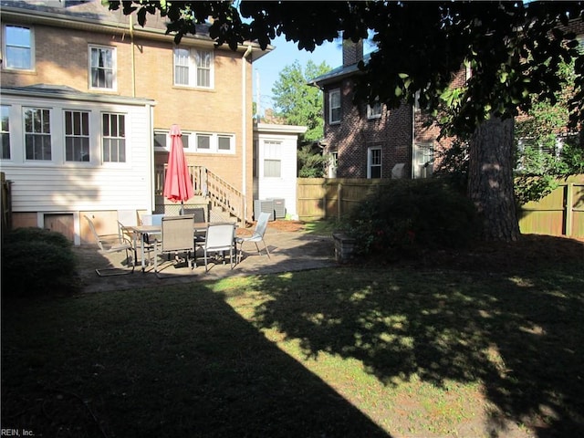 view of yard featuring a patio area and fence