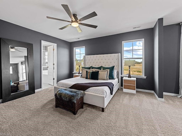 bedroom featuring a ceiling fan, baseboards, visible vents, and carpet flooring