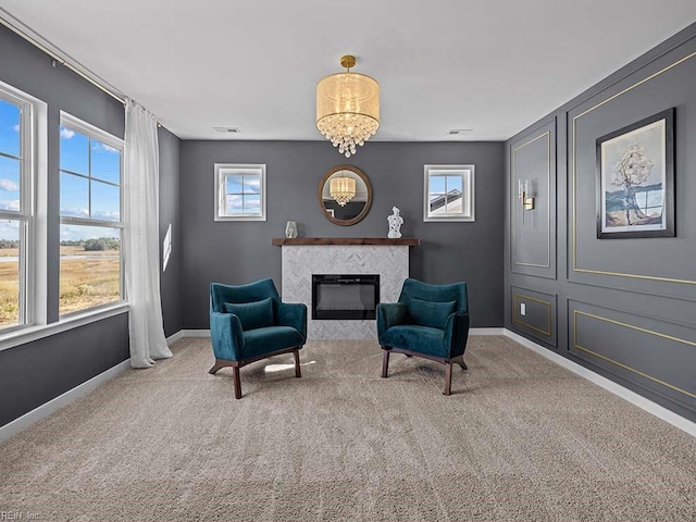 living area featuring carpet floors, visible vents, a fireplace, and baseboards