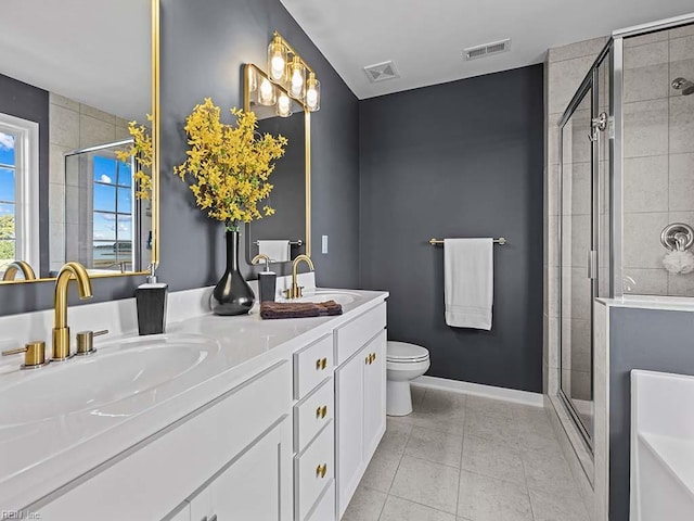 full bathroom featuring a stall shower, tile patterned flooring, visible vents, and a sink