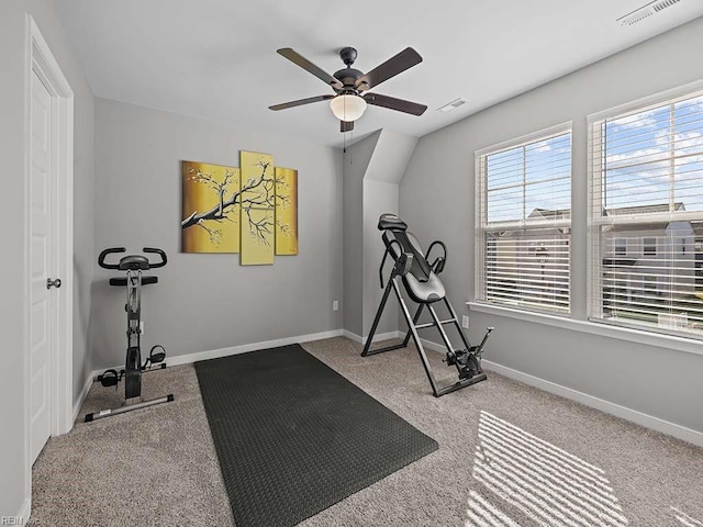 exercise area with carpet flooring, visible vents, and baseboards