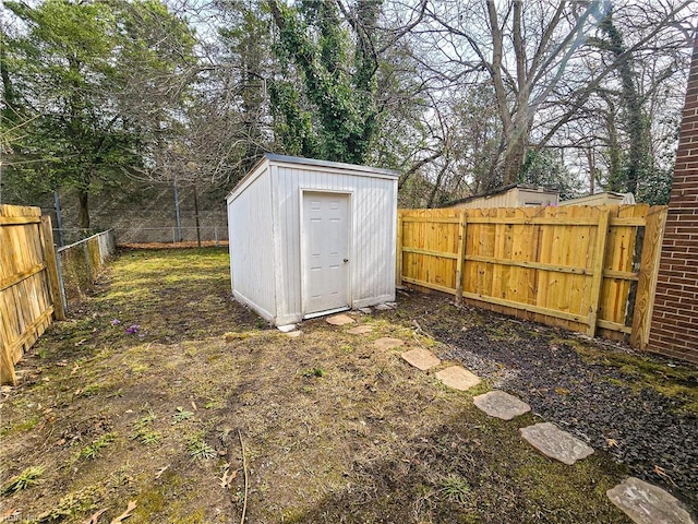 view of shed with a fenced backyard