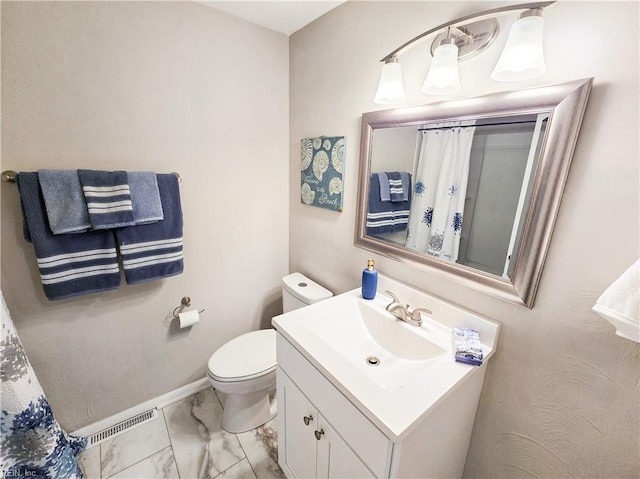 bathroom with marble finish floor, visible vents, toilet, vanity, and baseboards