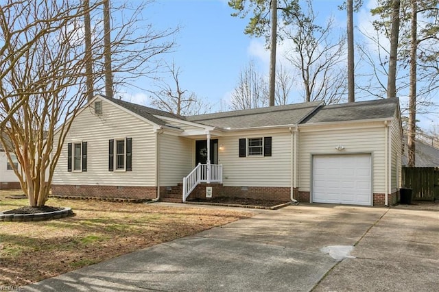 view of front facade featuring crawl space, an attached garage, and concrete driveway