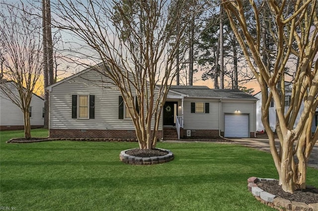 ranch-style house with a garage, driveway, a front lawn, and crawl space