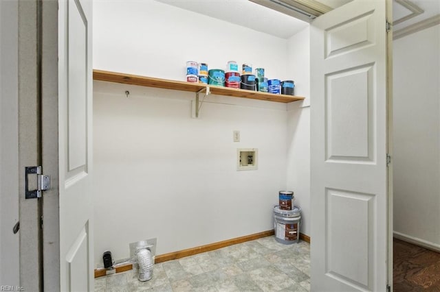 laundry area with laundry area, hookup for a washing machine, and baseboards