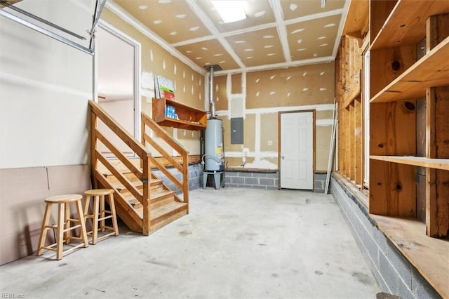 interior space featuring a garage, strapped water heater, electric panel, and concrete flooring