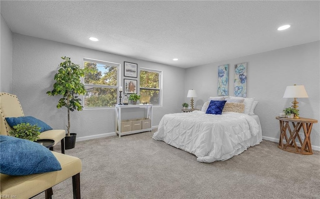 bedroom featuring carpet, a textured ceiling, baseboards, and recessed lighting