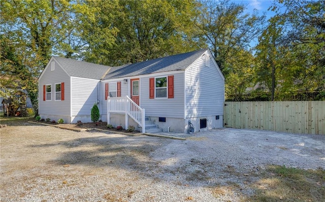 view of front of property featuring fence