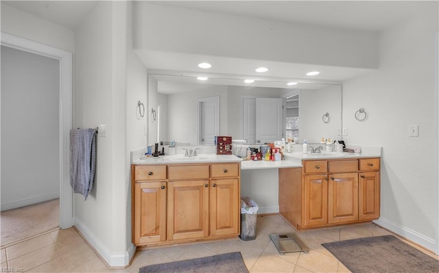 full bathroom with double vanity, baseboards, tile patterned floors, a sink, and recessed lighting