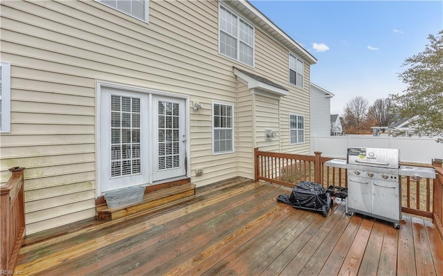 wooden terrace featuring fence and grilling area