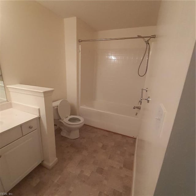 bathroom with toilet, tub / shower combination, and vanity