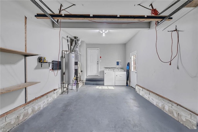 garage with separate washer and dryer and gas water heater