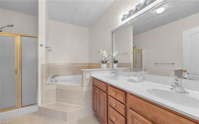 full bathroom featuring a bath, a stall shower, a sink, and tile patterned floors