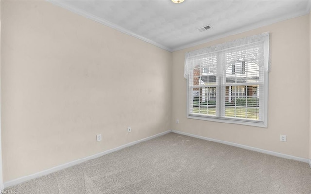 unfurnished room with visible vents, baseboards, carpet flooring, and ornamental molding