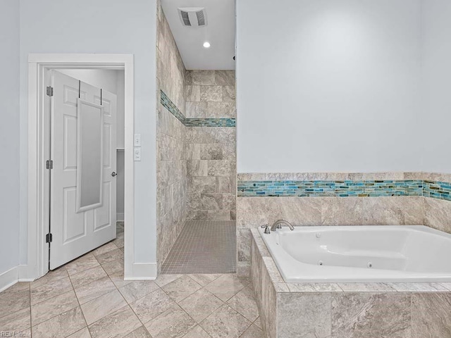 full bath with tiled shower, visible vents, and a bath