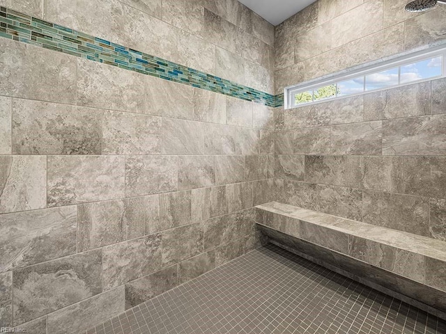 bathroom with tiled shower