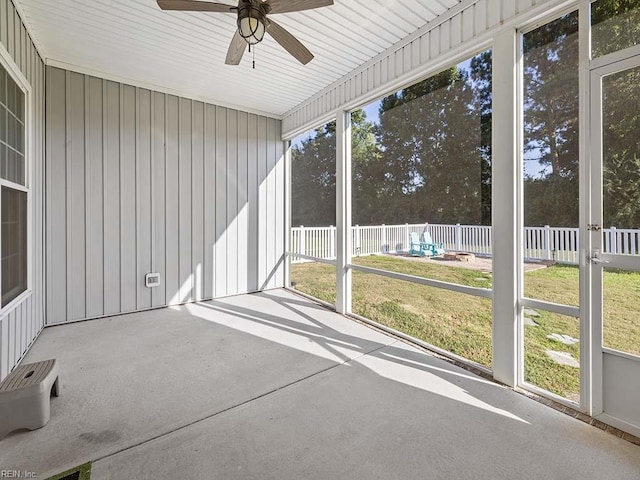 unfurnished sunroom with plenty of natural light and ceiling fan