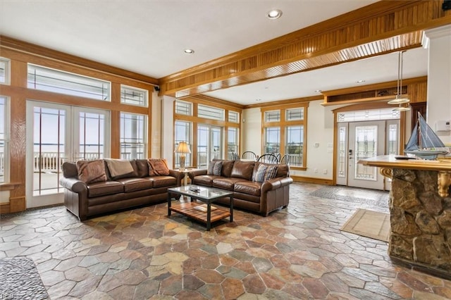 9954 Bonniville Rd, Hayes, VA 23072 - living area featuring ornamental molding, a wealth of natural light, french doors, and stone finish floor