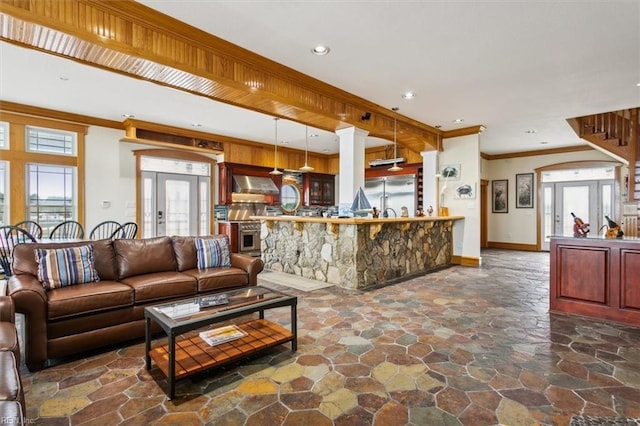 9954 Bonniville Rd, Hayes, VA 23072 - living area with a community bar, baseboards, french doors, stone finish flooring, and crown molding
