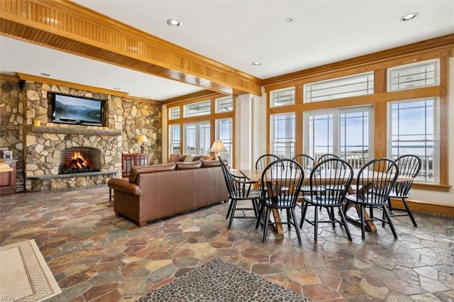 9954 Bonniville Rd, Hayes, VA 23072 - dining space featuring recessed lighting, plenty of natural light, stone tile flooring, and a stone fireplace