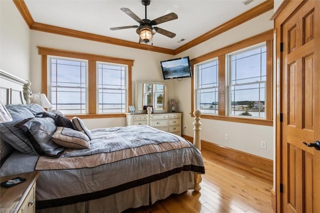 9954 Bonniville Rd, Hayes, VA 23072 - bedroom featuring light wood-style floors, multiple windows, and ornamental molding