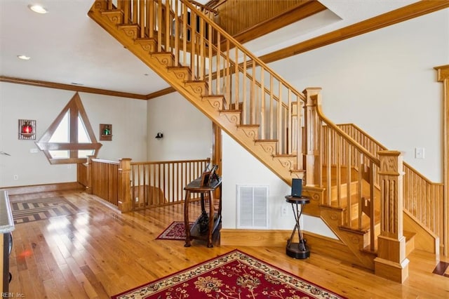 9954 Bonniville Rd, Hayes, VA 23072 - staircase featuring recessed lighting, visible vents, ornamental molding, wood finished floors, and baseboards