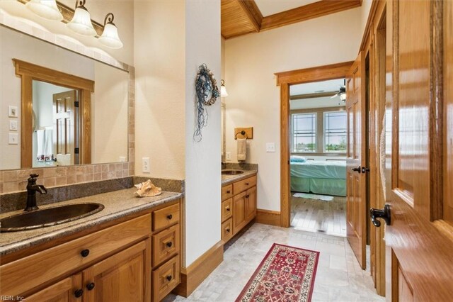 9954 Bonniville Rd, Hayes, VA 23072 - ensuite bathroom featuring crown molding, vanity, and ensuite bathroom