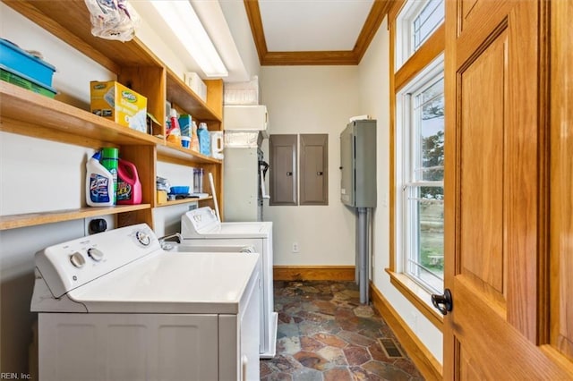 9954 Bonniville Rd, Hayes, VA 23072 - clothes washing area with crown molding, washing machine and dryer, stone finish flooring, laundry area, and plenty of natural light