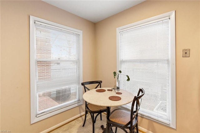 dining space with baseboards